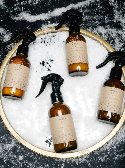 2023 holiday collection luxury room + linen spray in 4oz amber glass with black sprayers by elle moss, co.
