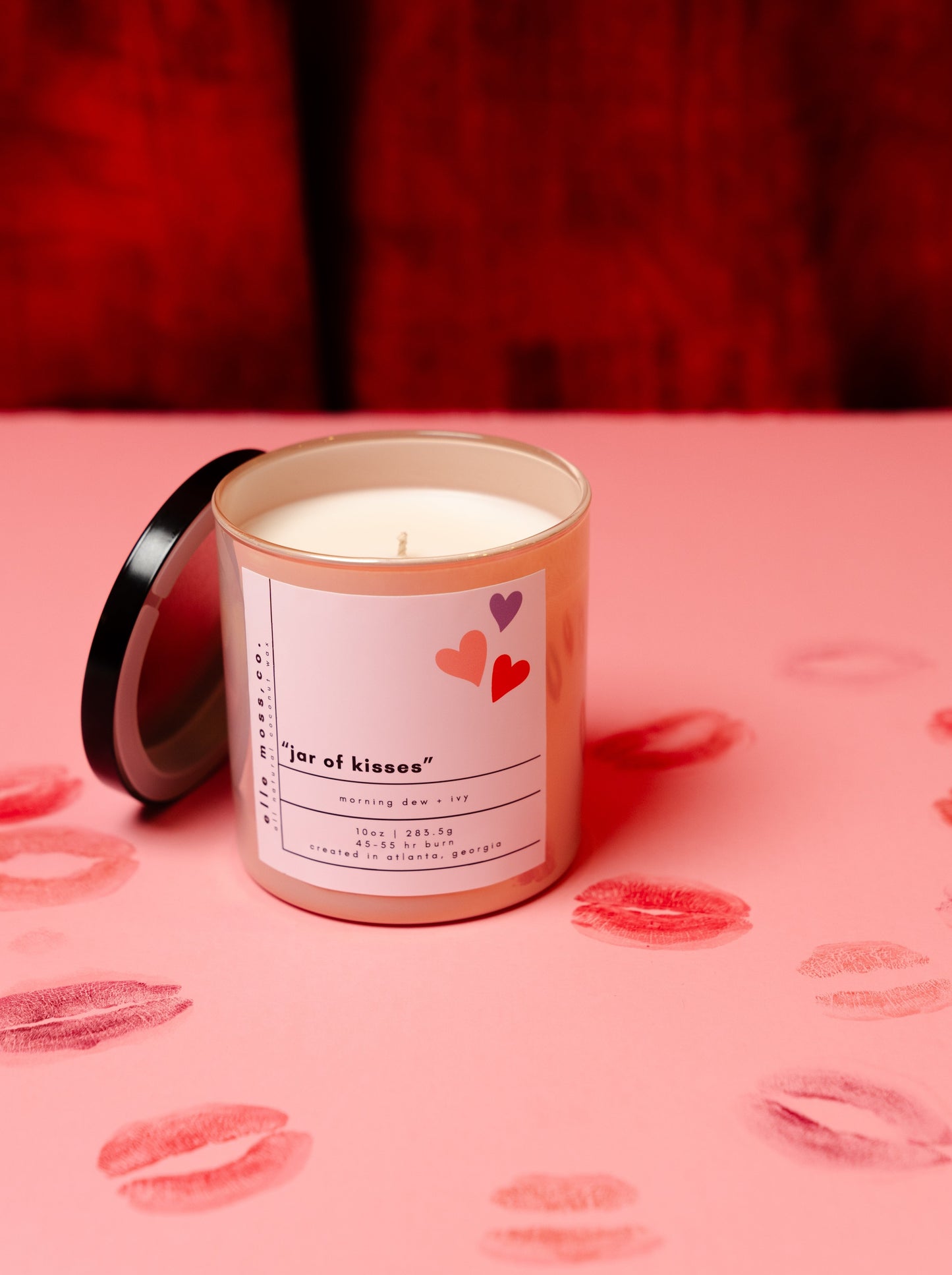 rosewater coconut wax candle with lipstick kisses background